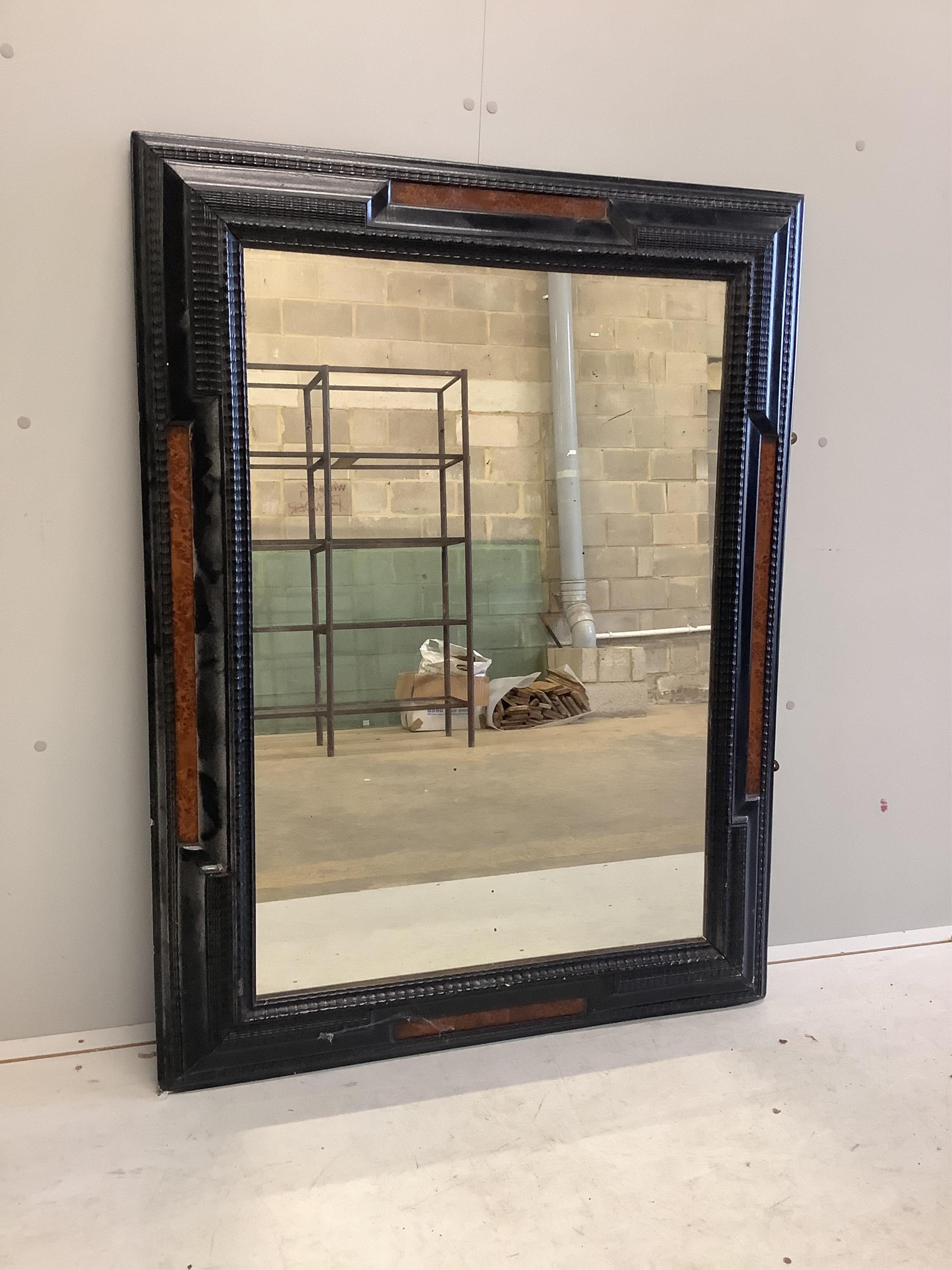 A Dutch style ebonised and amboyna rectangular wall mirror, width 95cm, height 126cm. Condition - fair to good